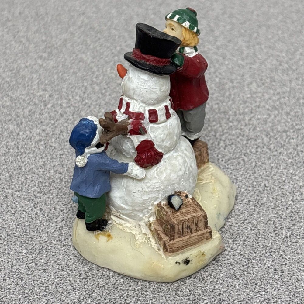 Christmas Village Children Building A Snowman Figurine, 2” Tall - Picture 6 of 7